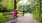 father and daughter bike along park path